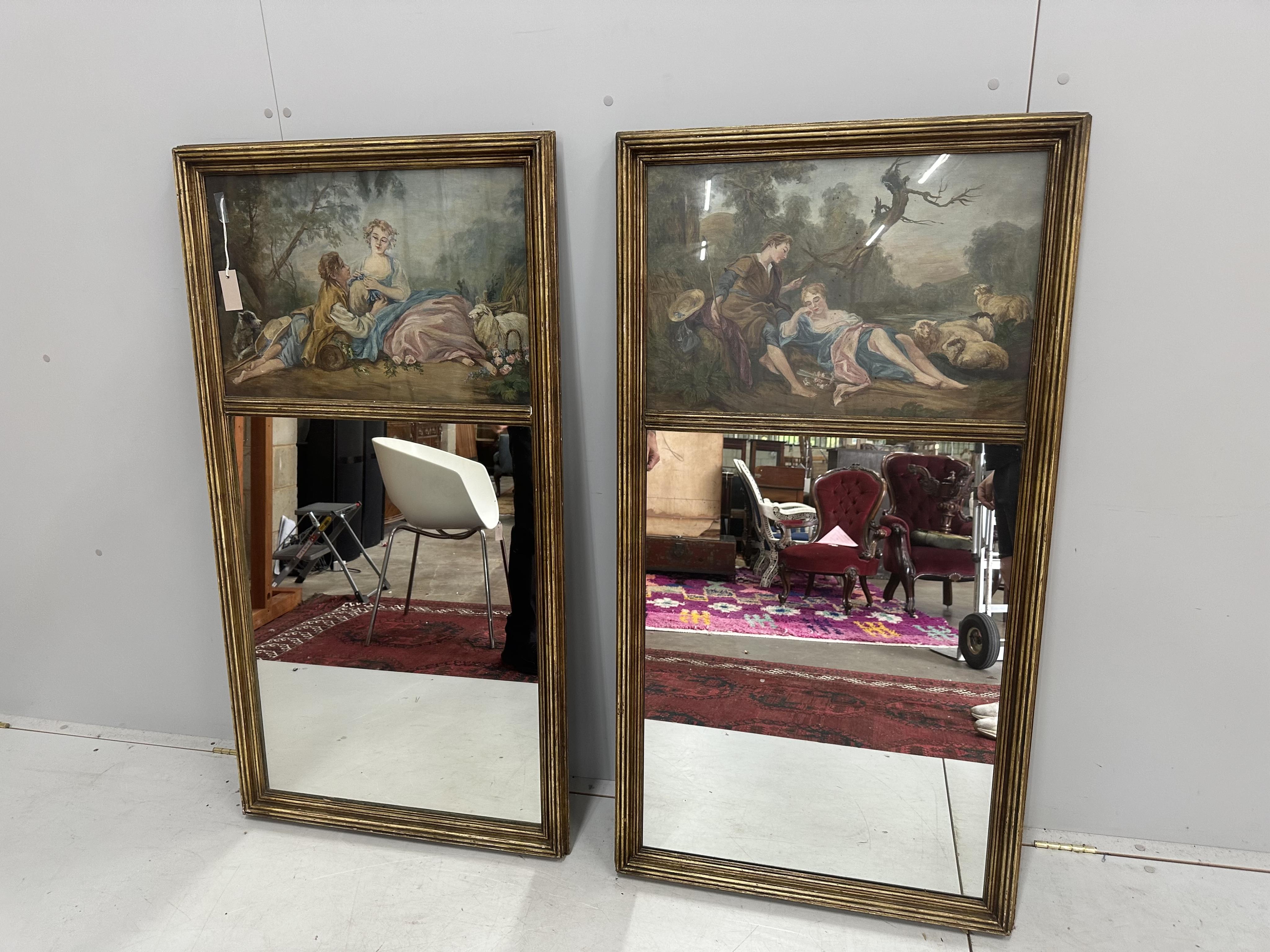 A pair of rectangular giltwood and composition trumeau wall mirrors, painted with figures and sheep in rural landscapes, width 69cm, height 130cm. Condition - fair